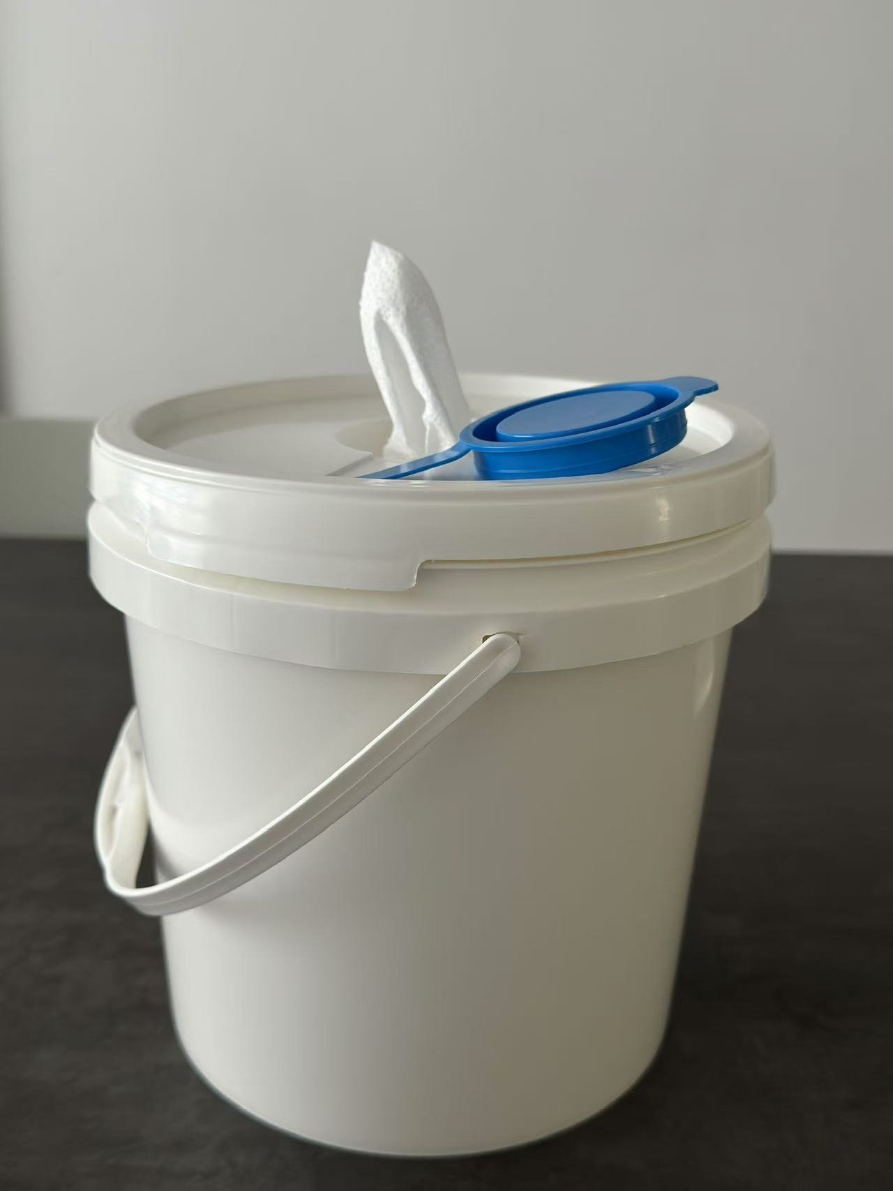 Refillable Plastic Bucket for Industrial Wipes This durable plastic bucket is designed to hold dry rolls of wipes, which can be soaked with your own cleaning or disinfectant solution to create industrial wet wipes. The refillable design ensures cost savings and flexibility, while the sealed lid keeps wipes fresh and ready for use. Ideal for factories, workshops, automotive, and maintenance industries.